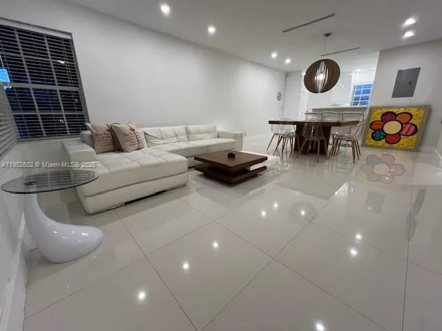 a view of a room with furniture and air hockey table