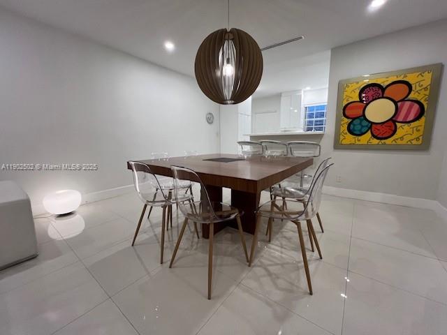 1125 99th Street, Unit 12 Bay Harbor Islands, FL 33154 - Photo 45 of 62 a view of a dining room and hall with furniture