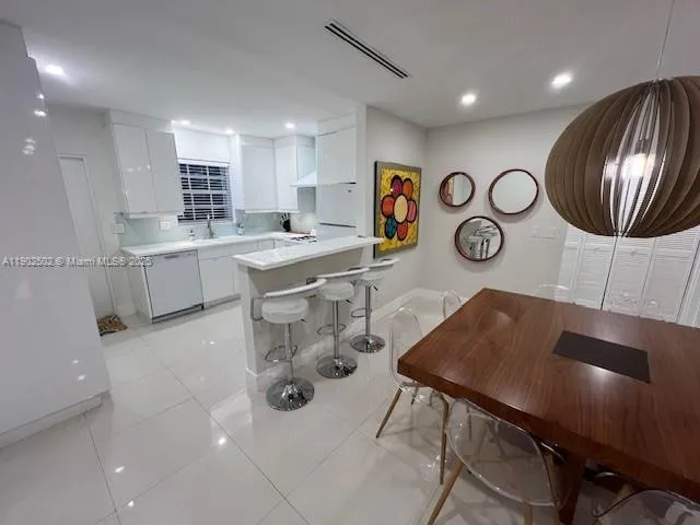a bathroom with a sink a mirror and a toilet