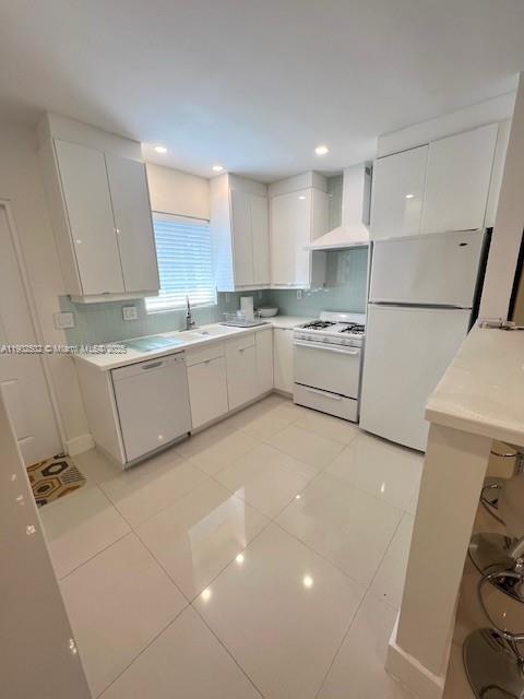1125 99th Street, Unit 12 Bay Harbor Islands, FL 33154 - Photo 5 of 62 a kitchen with a sink a stove and cabinets