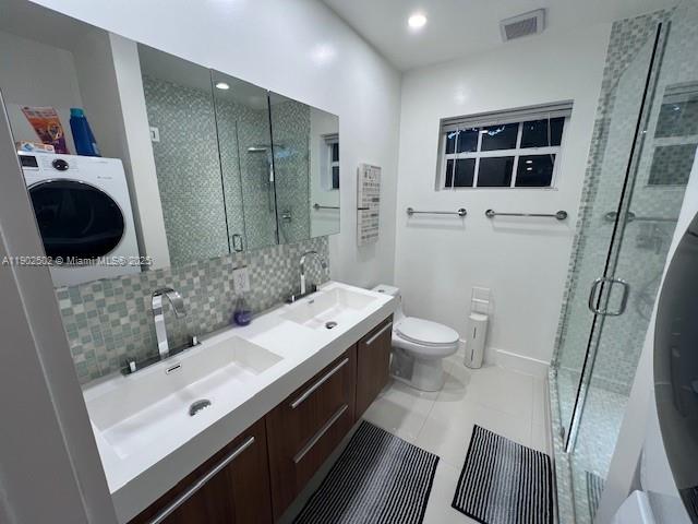 1125 99th Street, Unit 12 Bay Harbor Islands, FL 33154 - Photo 54 of 62 a bathroom with a sink a toilet and shower