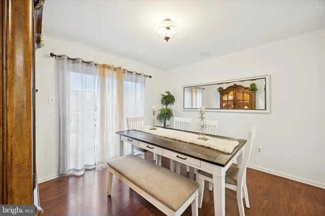a view of a livingroom with furniture window and wooden floor