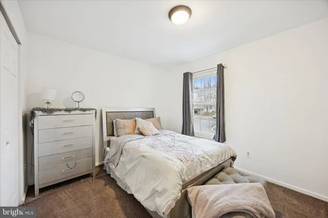 a bedroom with a bed and a cabinets