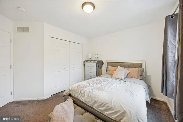 a bedroom with a bed and a cabinets