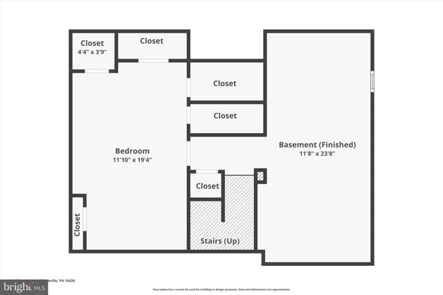 a black and white photo of a bench