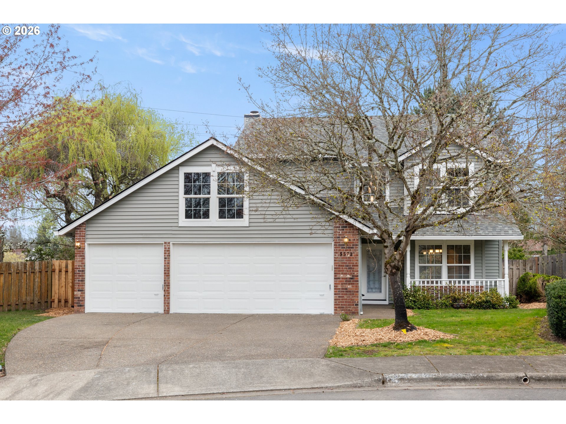 5572 Northwest 165th Place Portland, OR 97229 - Photo 1 of 48 a front view of a house with a yard