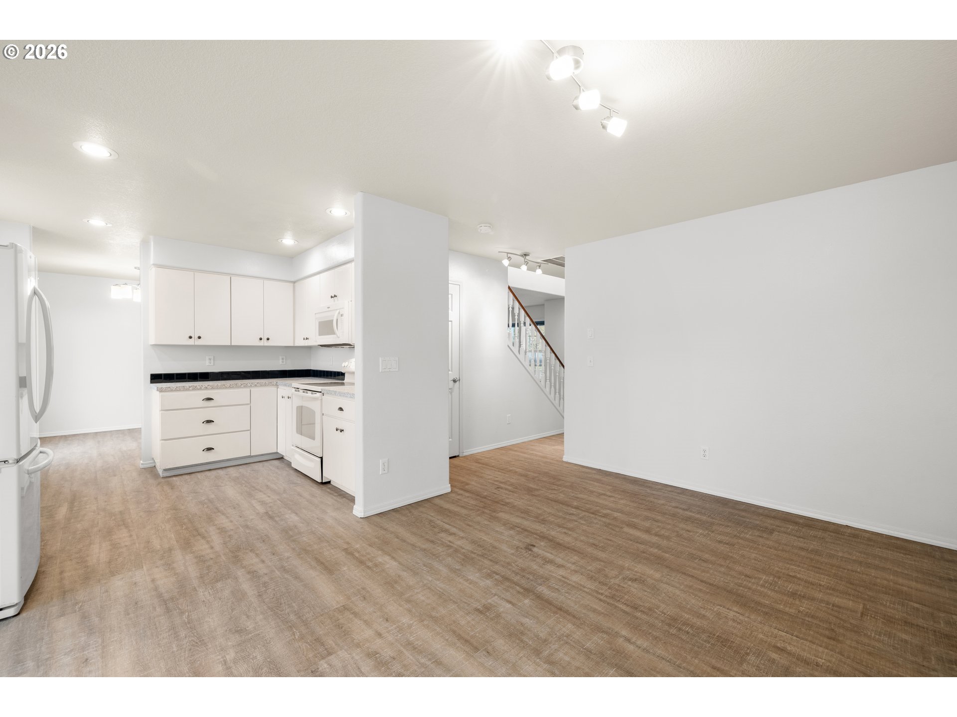 5572 Northwest 165th Place Portland, OR 97229 - Photo 15 of 48 a view of kitchen with wooden floor