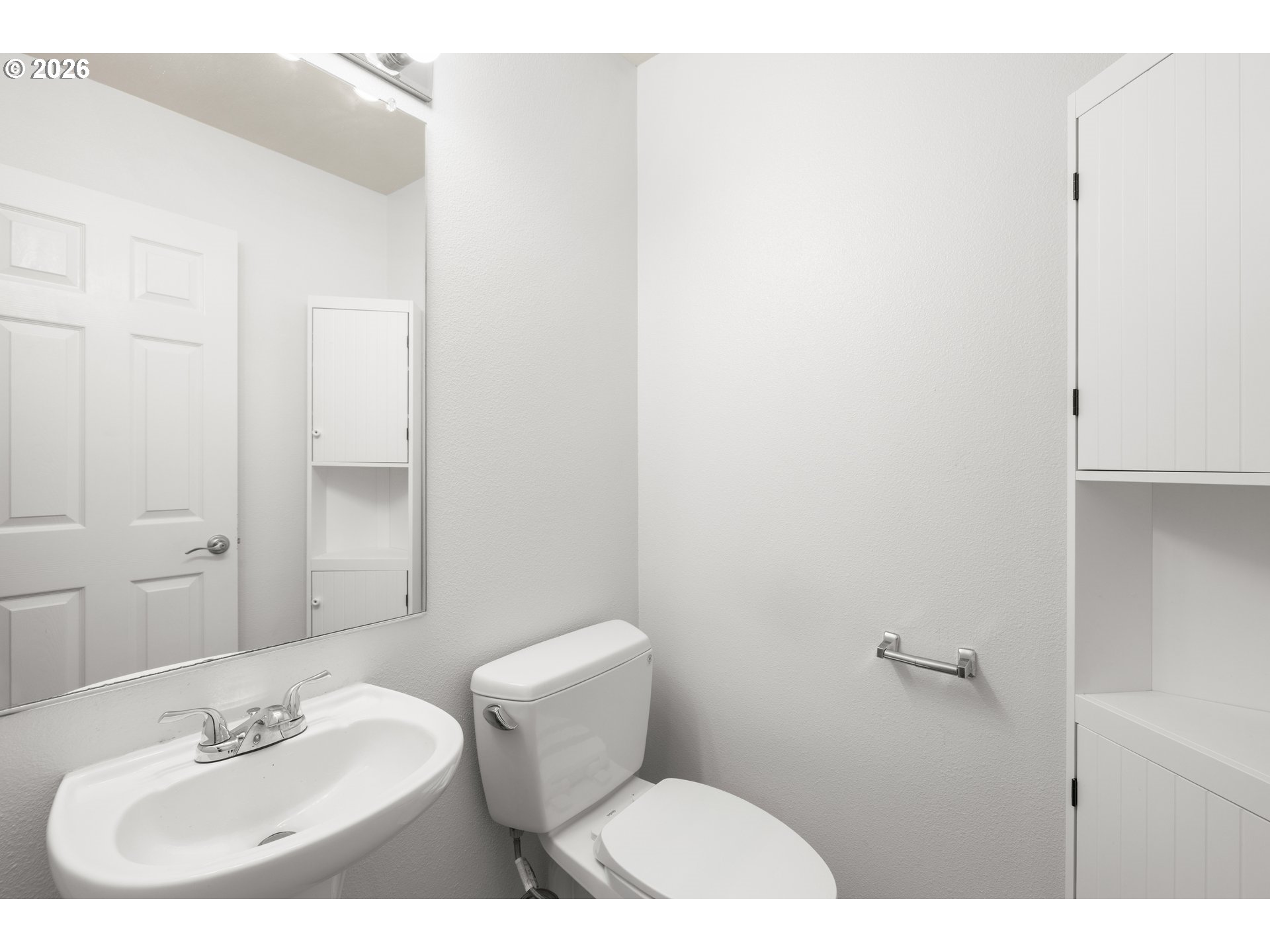 5572 Northwest 165th Place Portland, OR 97229 - Photo 20 of 48 a bathroom with a sink mirror and toilet