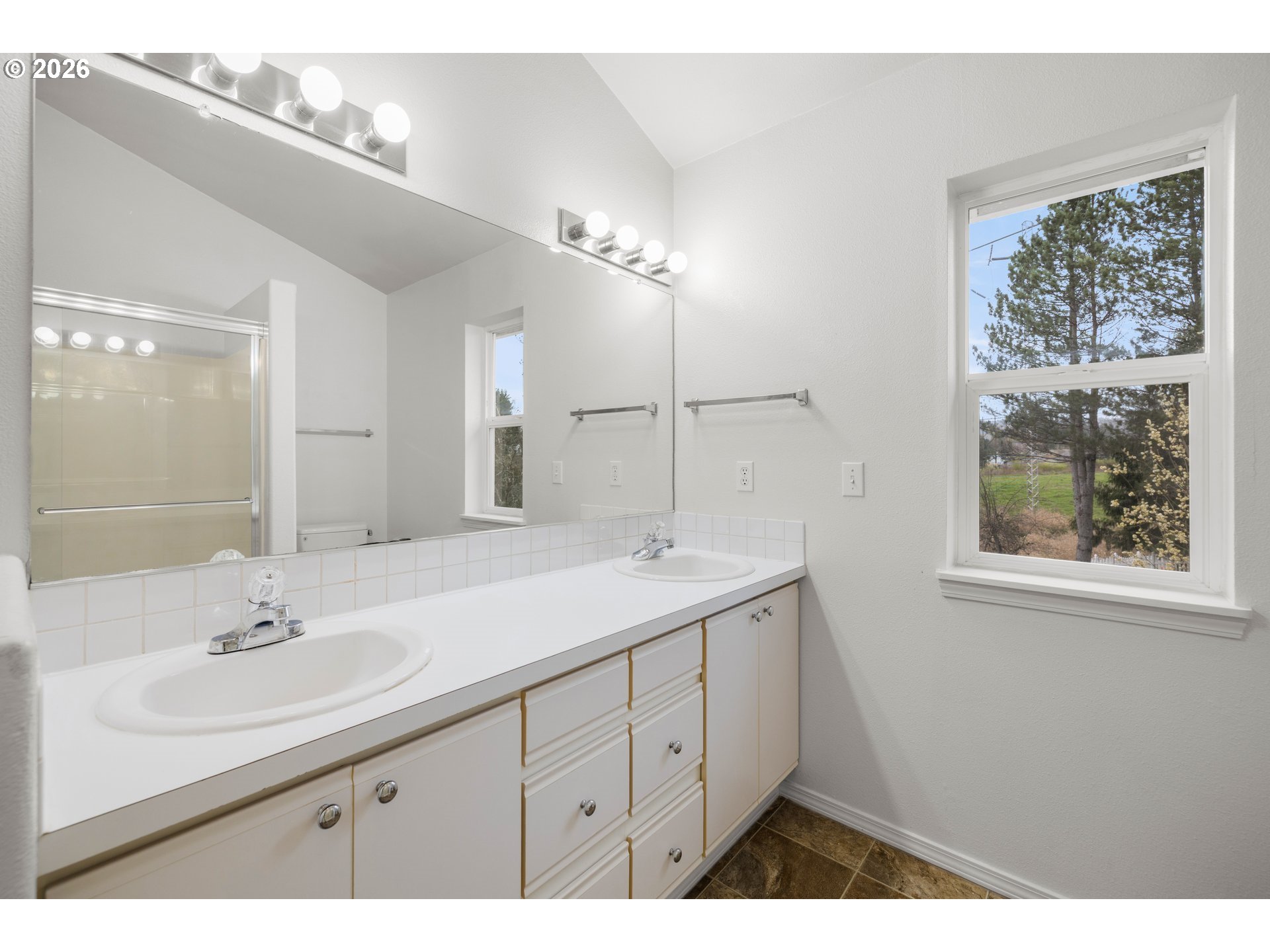 5572 Northwest 165th Place Portland, OR 97229 - Photo 26 of 48 a bathroom with a sink and a mirror