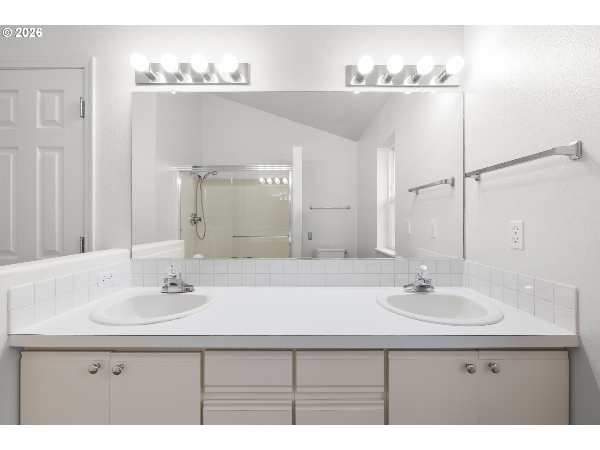 5572 Northwest 165th Place Portland, OR 97229 - Photo 27 of 48 a bathroom with a sink double vanity and a mirror