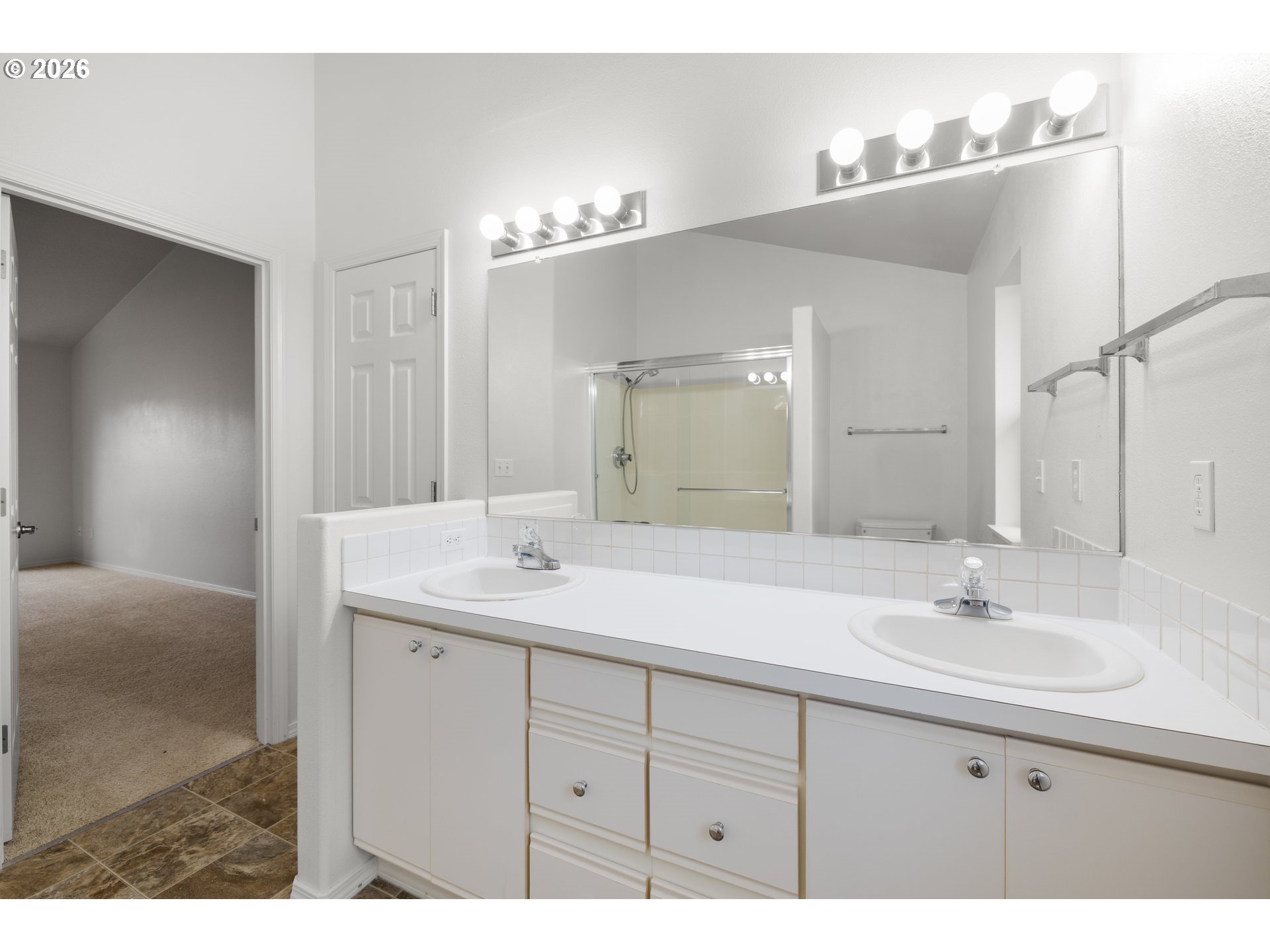 5572 Northwest 165th Place Portland, OR 97229 - Photo 28 of 48 a bathroom with a sink double vanity and a mirror