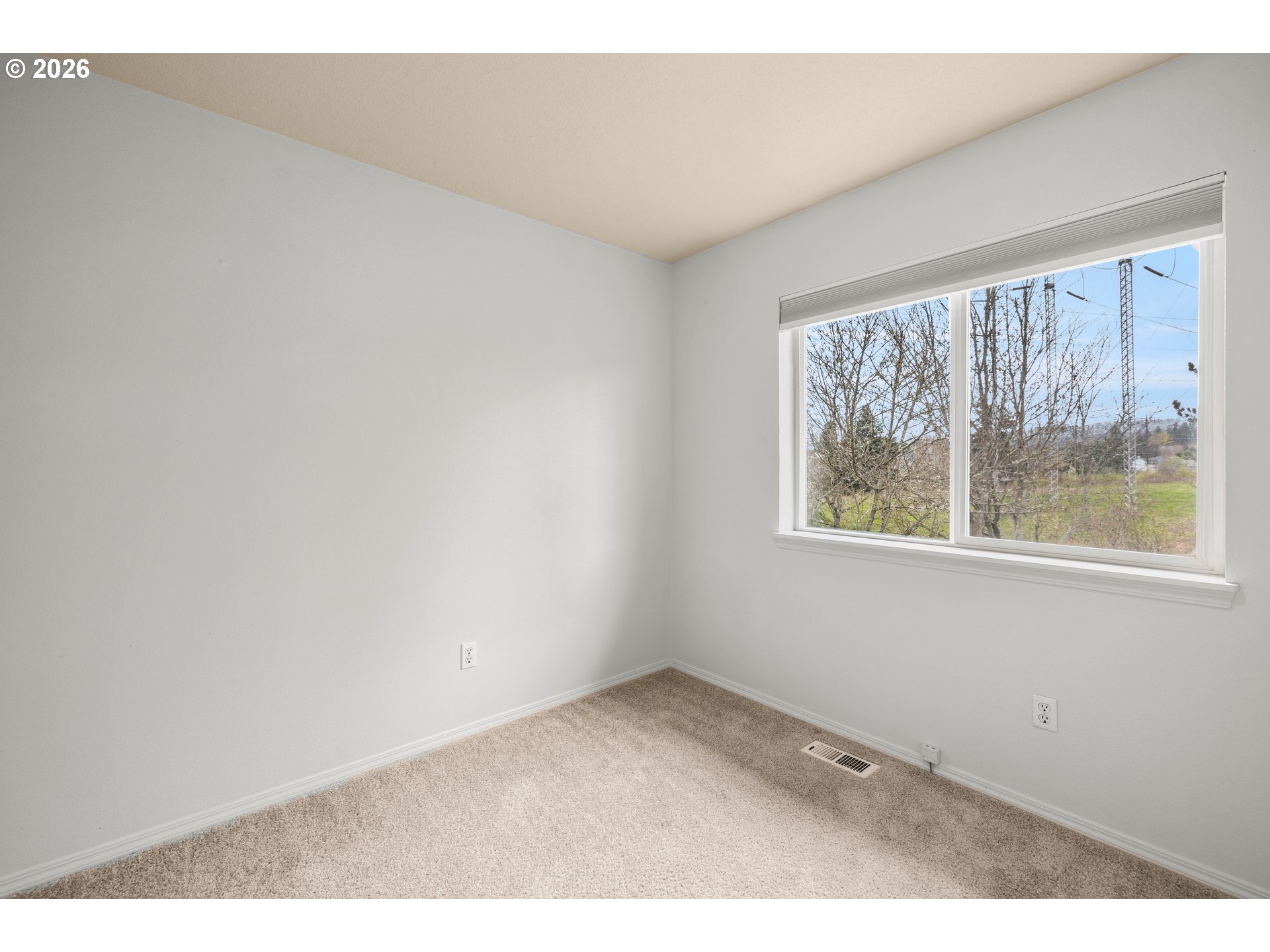 5572 Northwest 165th Place Portland, OR 97229 - Photo 29 of 48 an empty room with windows