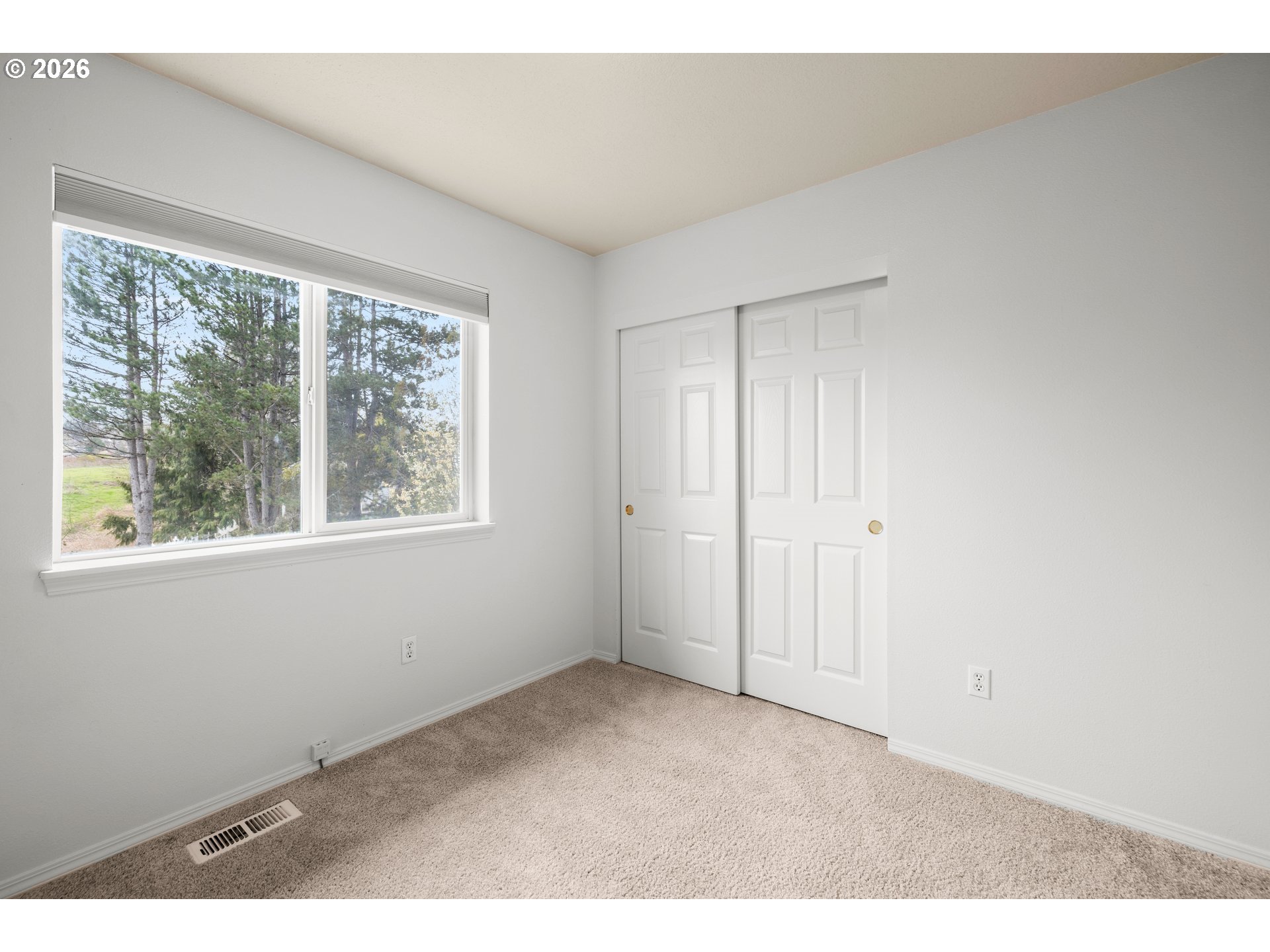 5572 Northwest 165th Place Portland, OR 97229 - Photo 30 of 48 a view of an empty room with a window