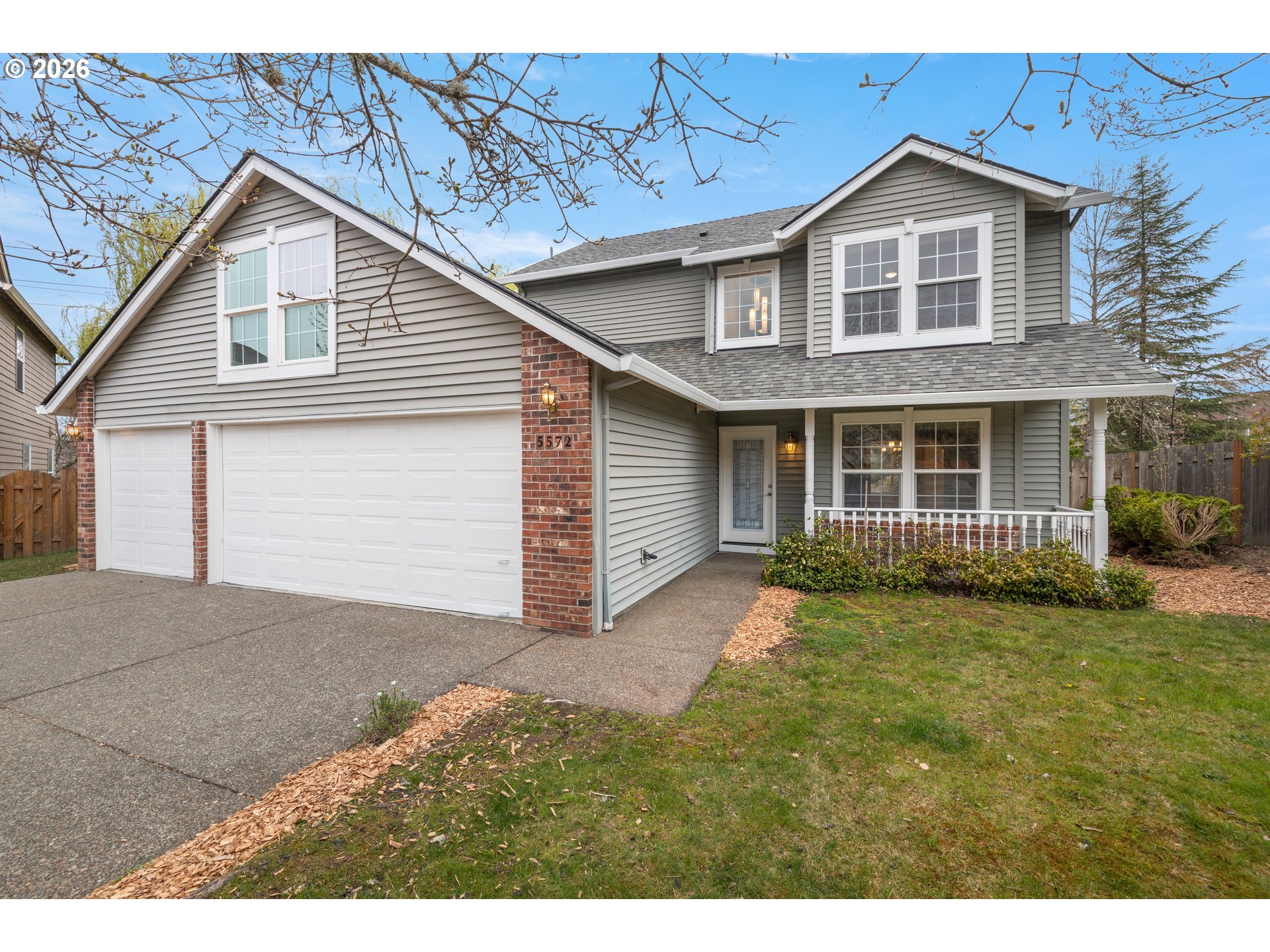5572 Northwest 165th Place Portland, OR 97229 - Photo 3 of 48 a front view of a house with a garden