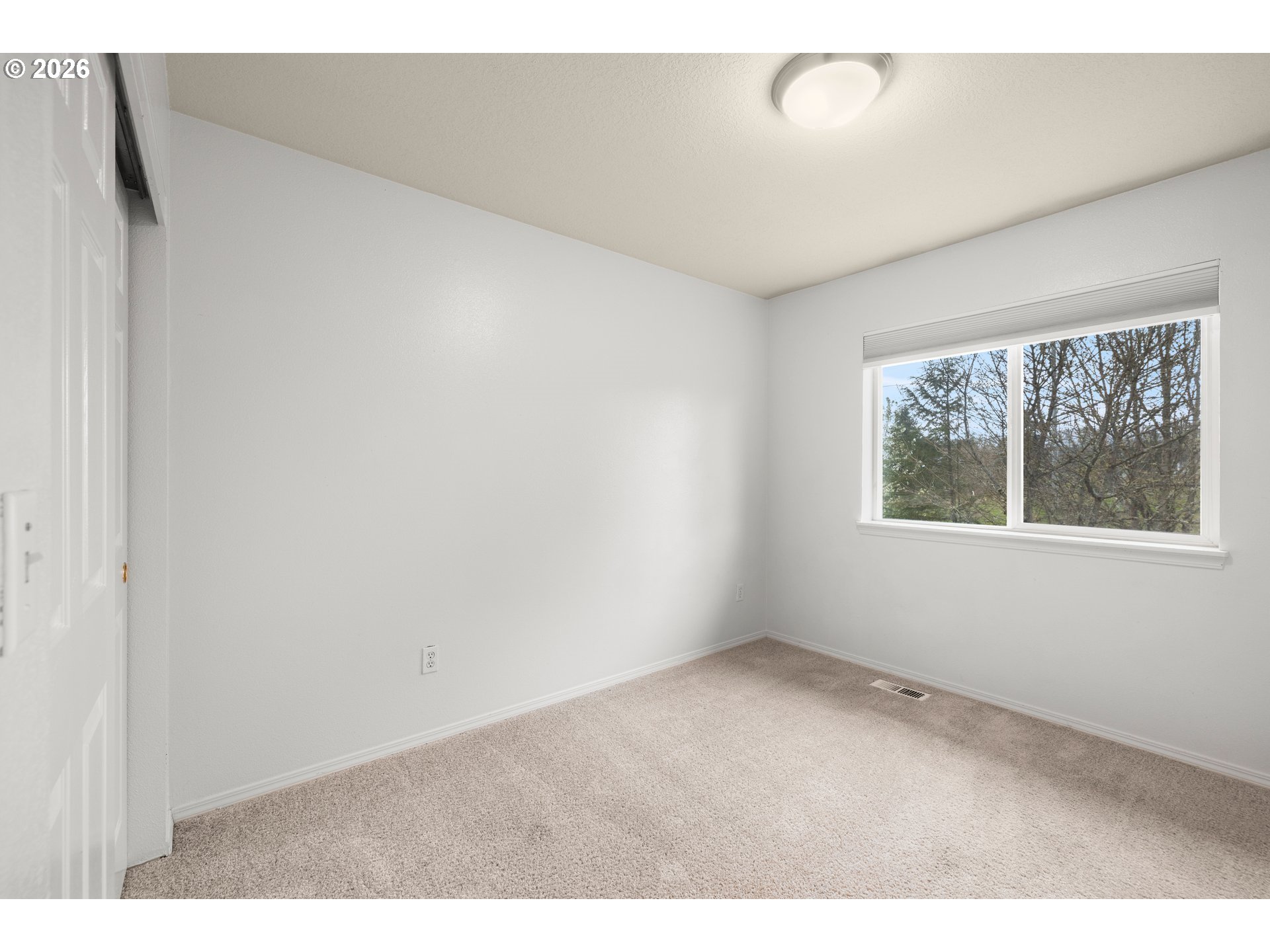 5572 Northwest 165th Place Portland, OR 97229 - Photo 32 of 48 an empty room with windows