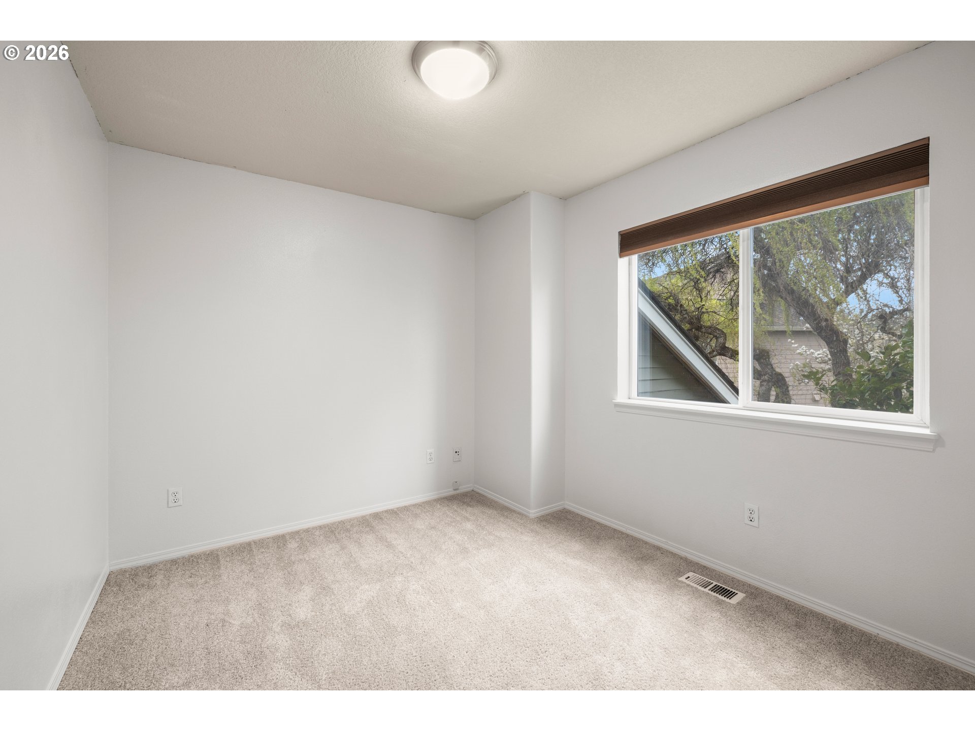 5572 Northwest 165th Place Portland, OR 97229 - Photo 33 of 48 a view of an empty room with a window