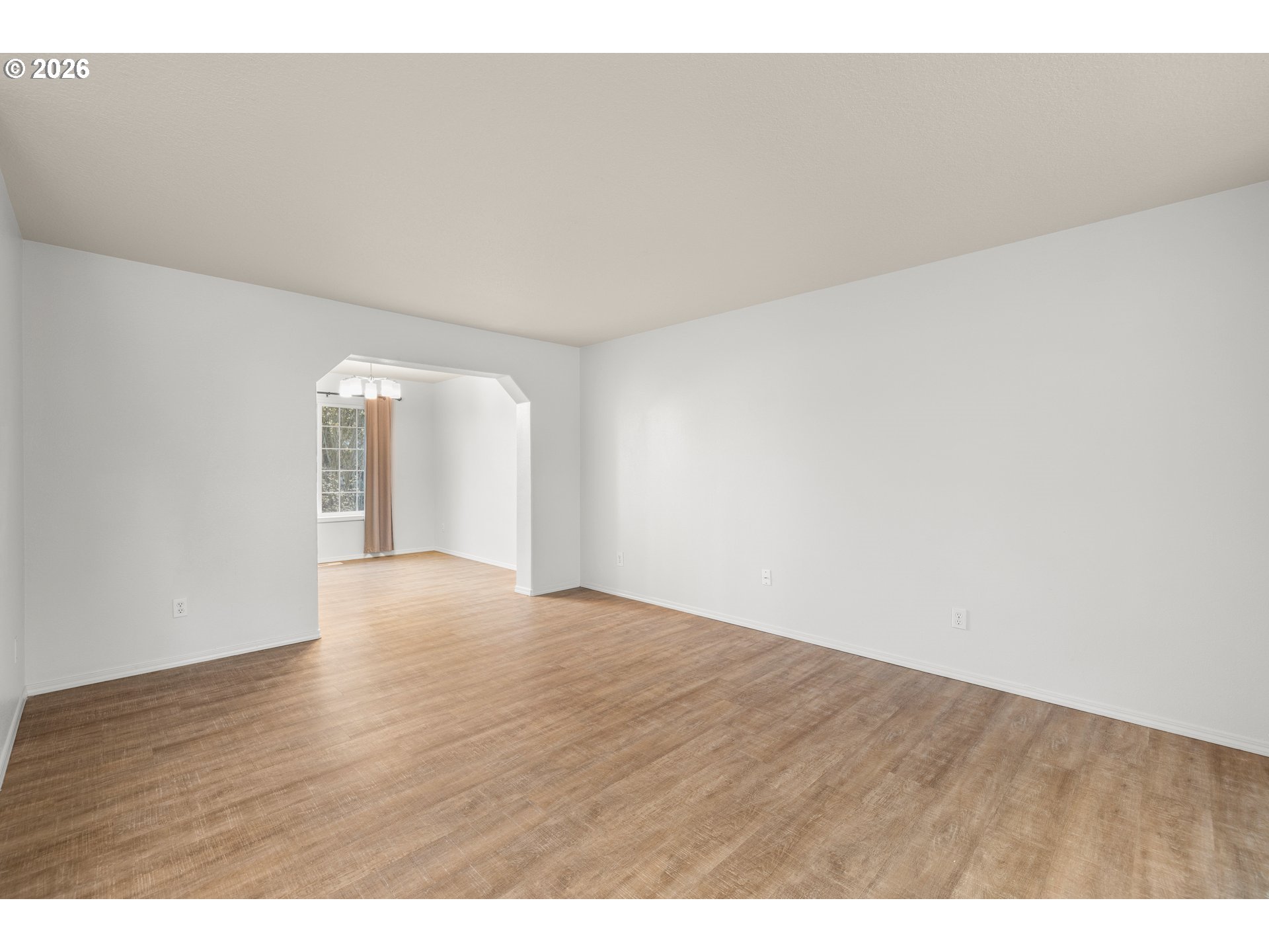 5572 Northwest 165th Place Portland, OR 97229 - Photo 6 of 48 a view of an empty room and wooden floor