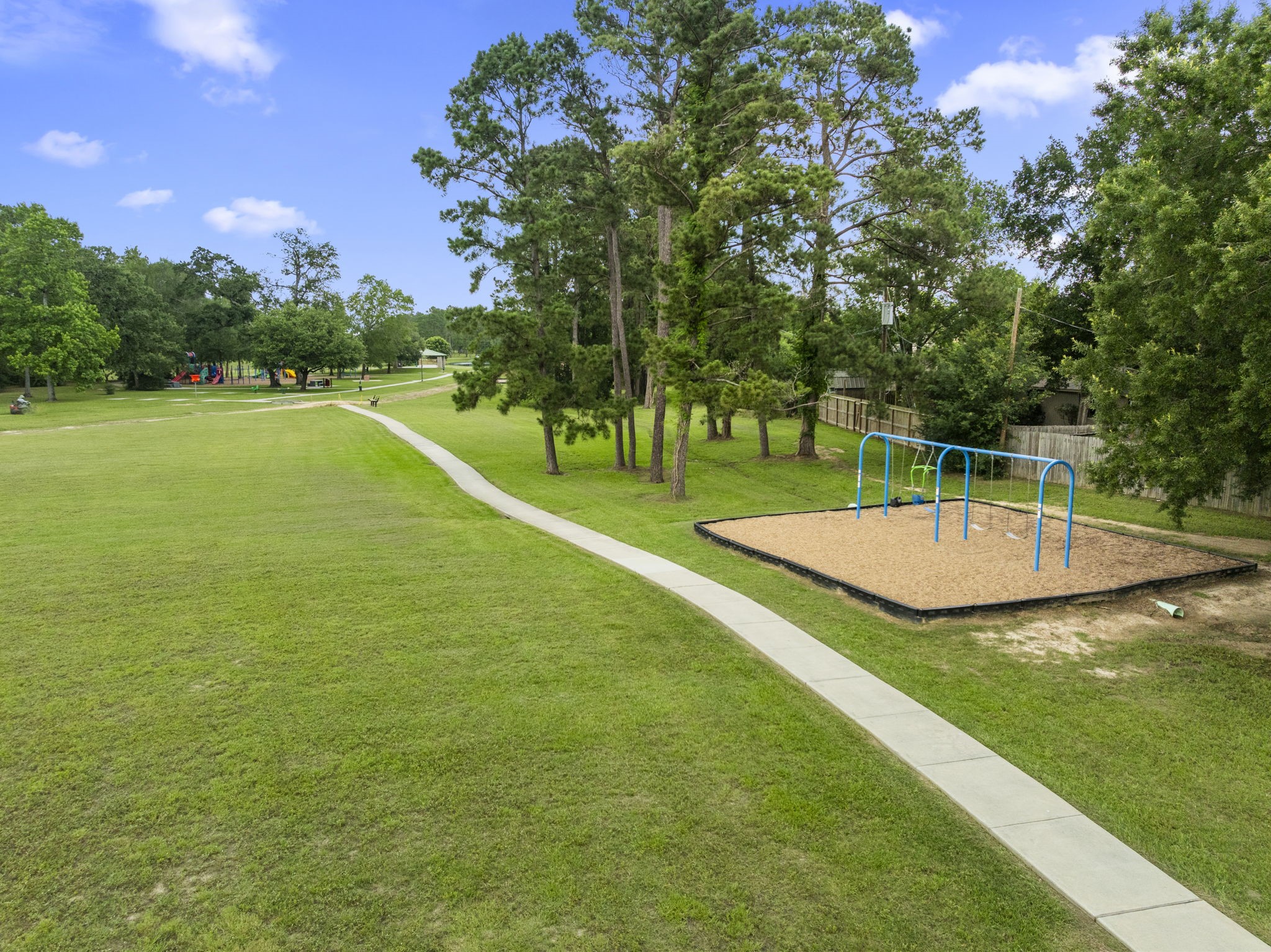 29106 Foxingham Circle Spring, TX 77386 - Photo 42 of 47 a view of a swimming pool with a yard and trees