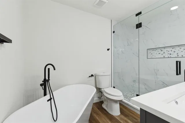 a bathroom with a toilet and a sink