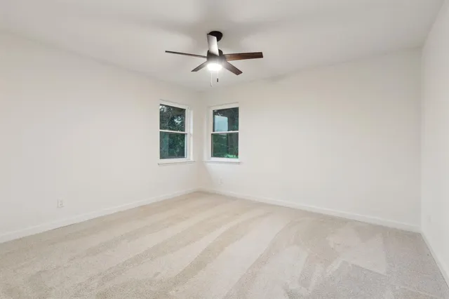 a view of empty room with windows