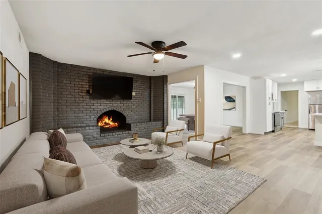 a living room with furniture and a fireplace