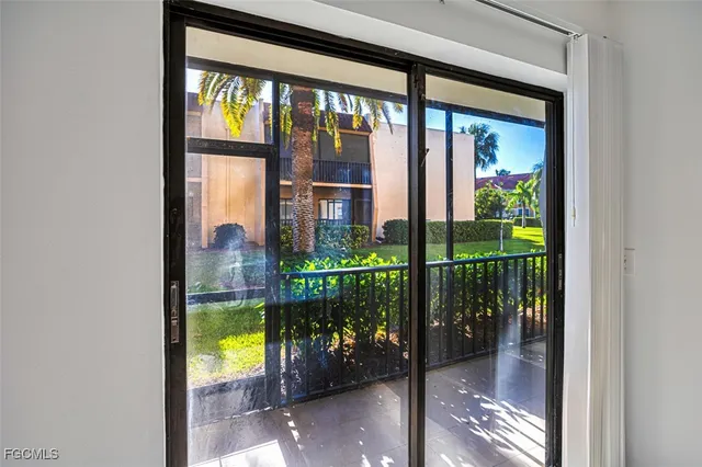a view of a balcony with a potted plant