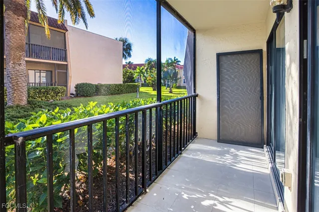 a view of a house with a porch and stairs