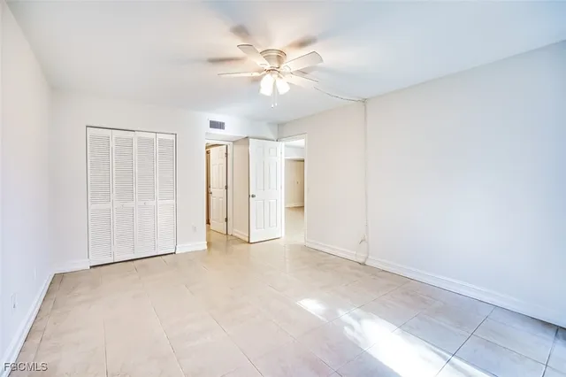 a bathroom with a granite countertop shower and a sink