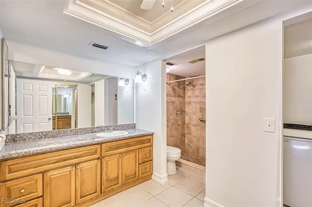a spacious bathroom with a mirror a sink and a bathtub