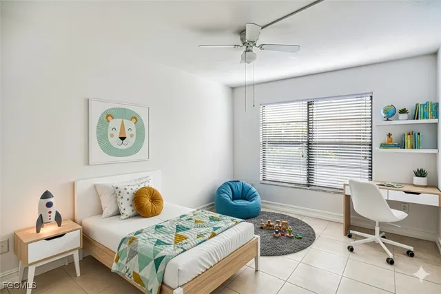 an empty room with chandelier fan and closet