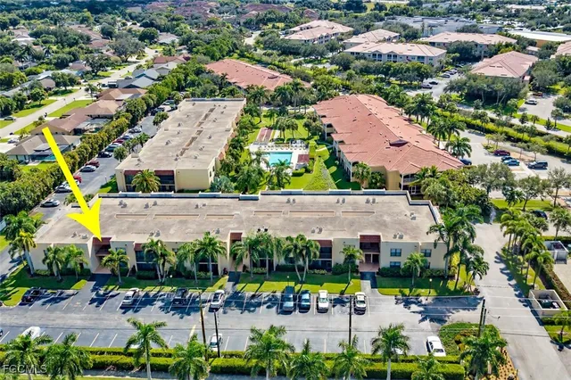an aerial view of an houses with outdoor space and swimming pool