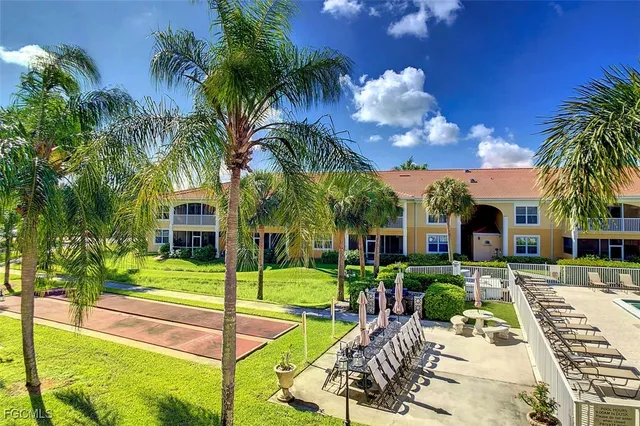 a view of a house with swimming pool and yard