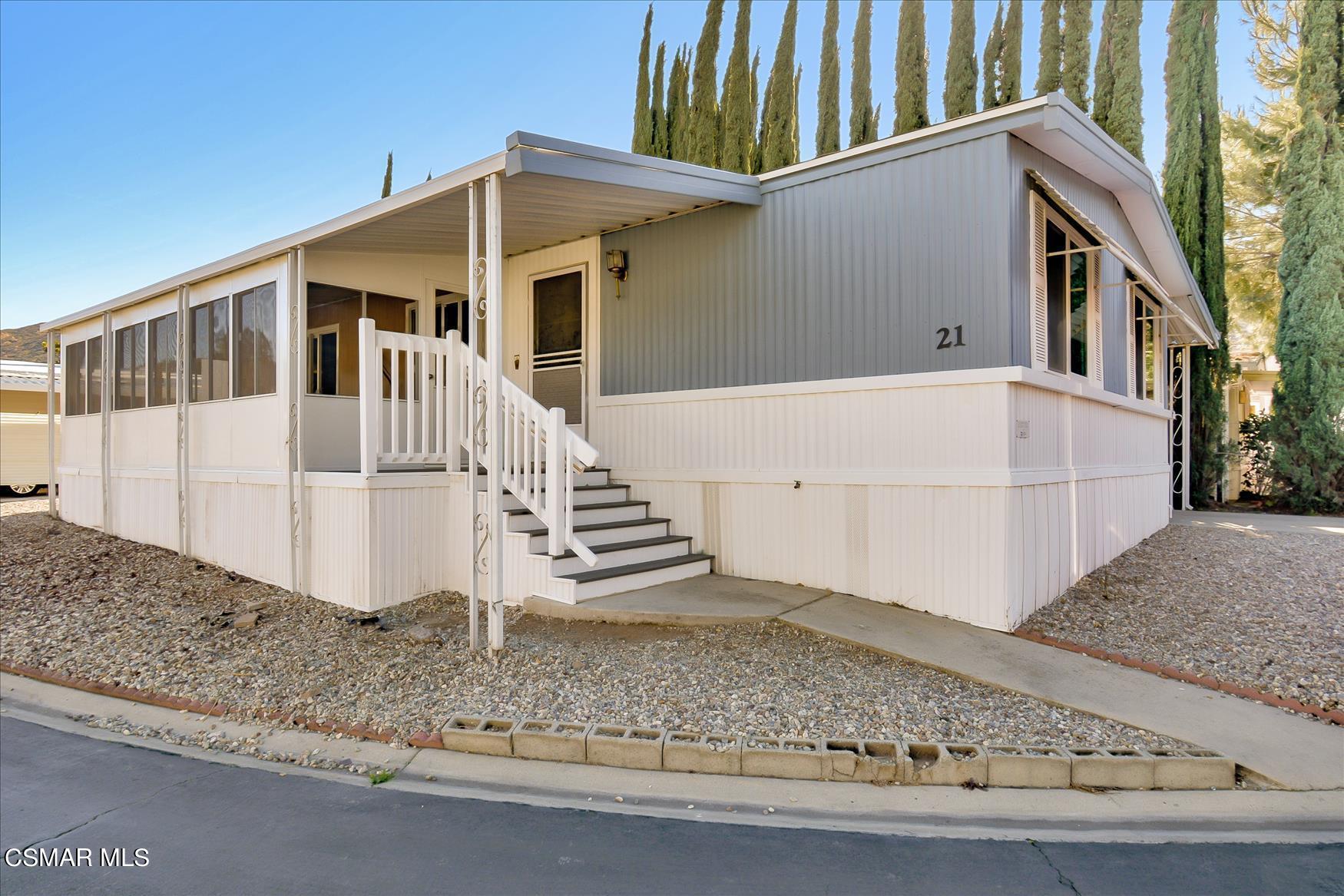 6480 Katherine Road, Unit 21 Simi Valley, CA 93063 - Photo 1 of 42 a view of a house with a yard