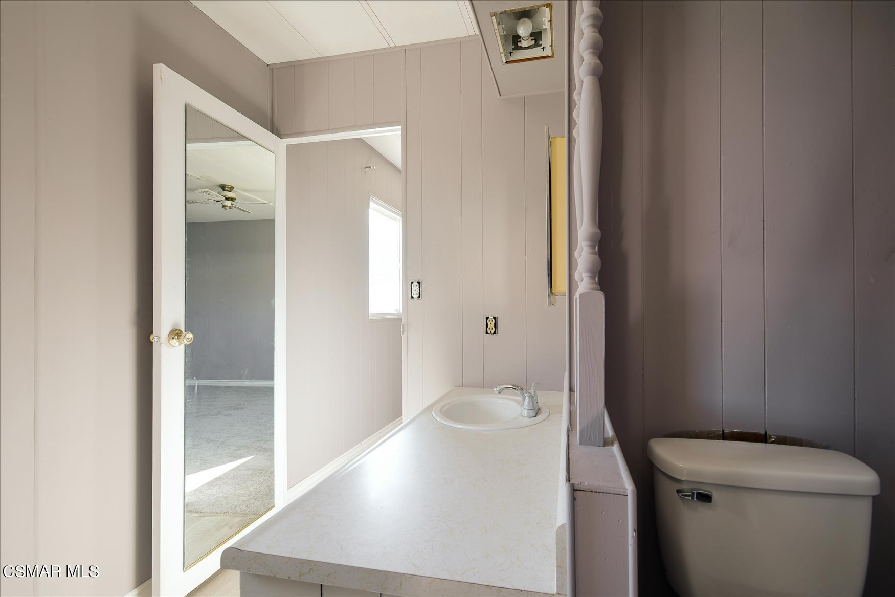 6480 Katherine Road, Unit 21 Simi Valley, CA 93063 - Photo 14 of 42 a bathroom with a toilet and a shower
