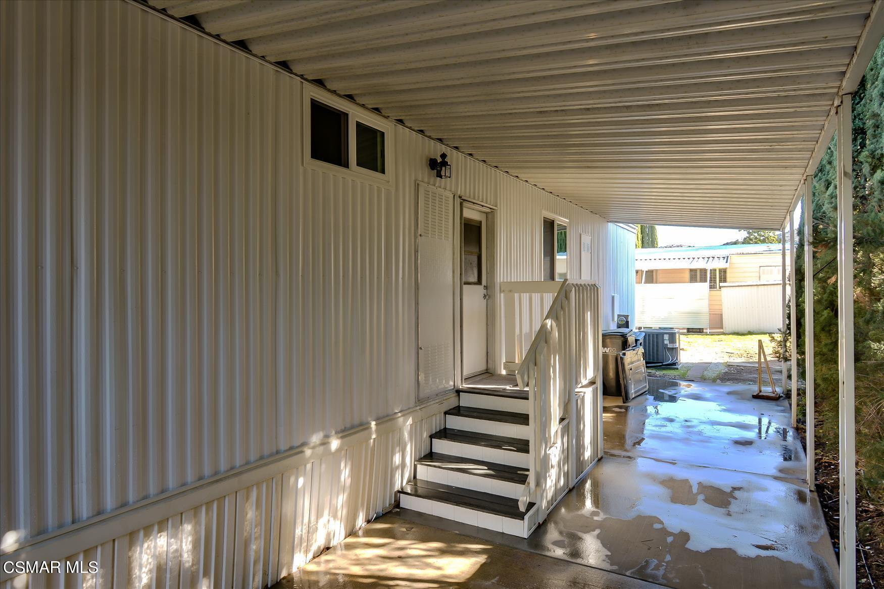 6480 Katherine Road, Unit 21 Simi Valley, CA 93063 - Photo 3 of 42 a view of entryway and hall with wooden floor