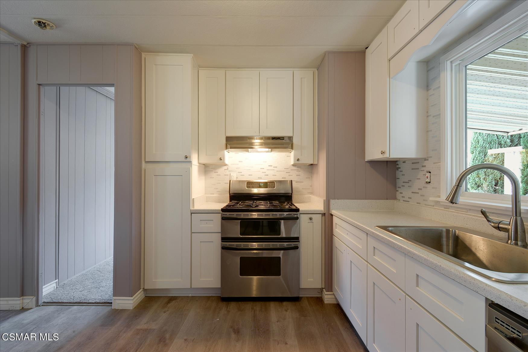 6480 Katherine Road, Unit 21 Simi Valley, CA 93063 - Photo 24 of 42 a kitchen with a stove and a sink