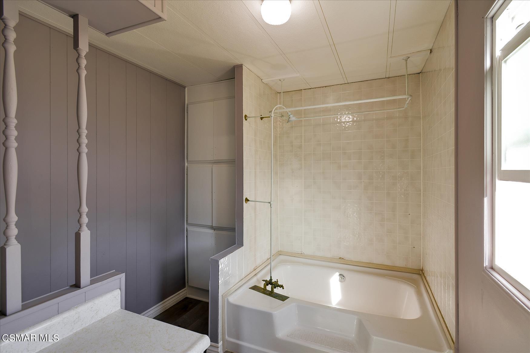 6480 Katherine Road, Unit 21 Simi Valley, CA 93063 - Photo 25 of 42 a bathroom with a bathtub and a window