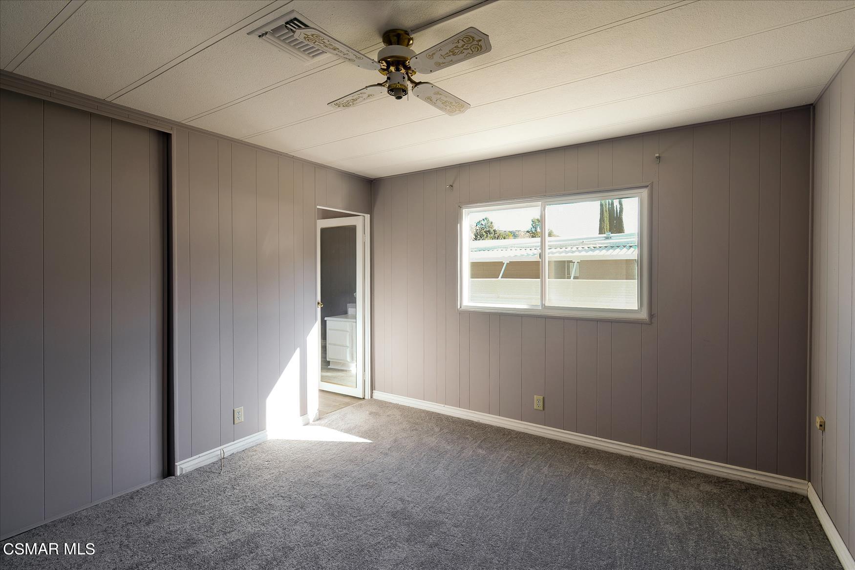 6480 Katherine Road, Unit 21 Simi Valley, CA 93063 - Photo 27 of 42 an empty room with windows and fan