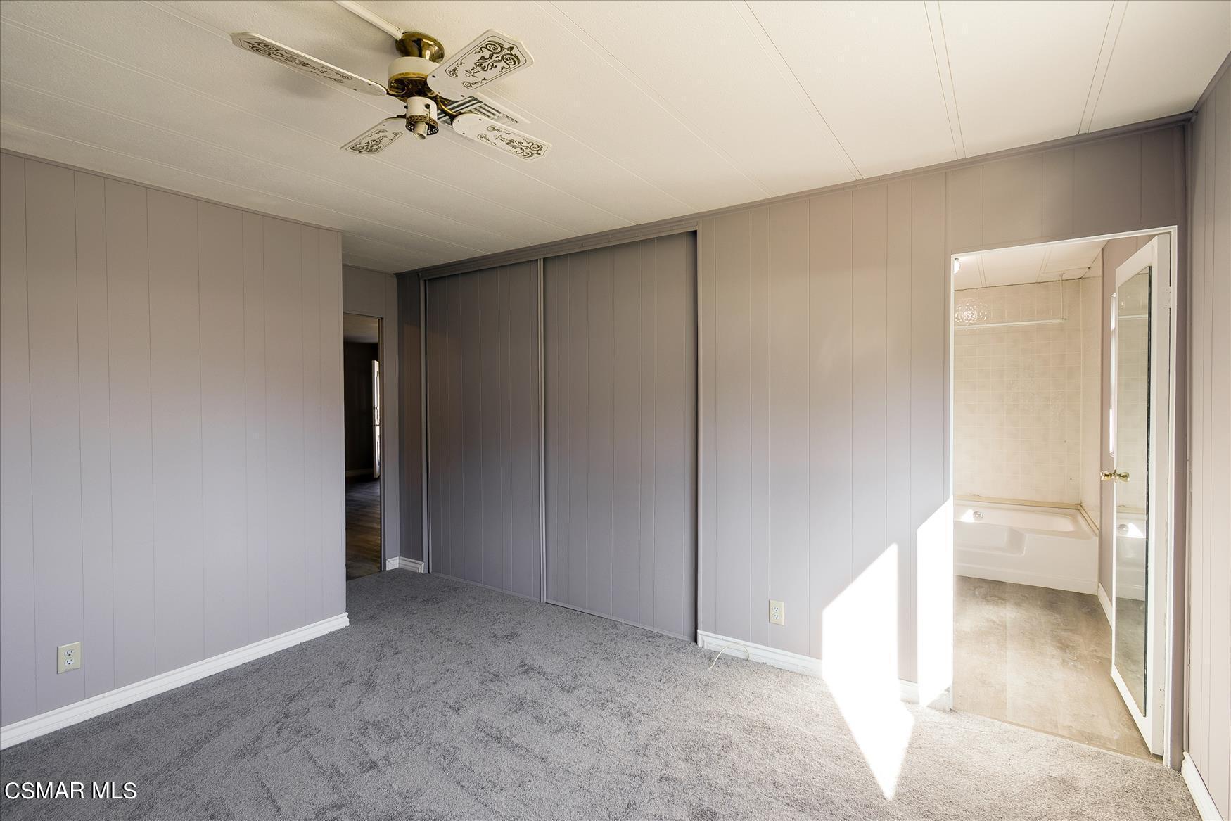 6480 Katherine Road, Unit 21 Simi Valley, CA 93063 - Photo 28 of 42 a view of a room with a walk in closet and wooden cabinet