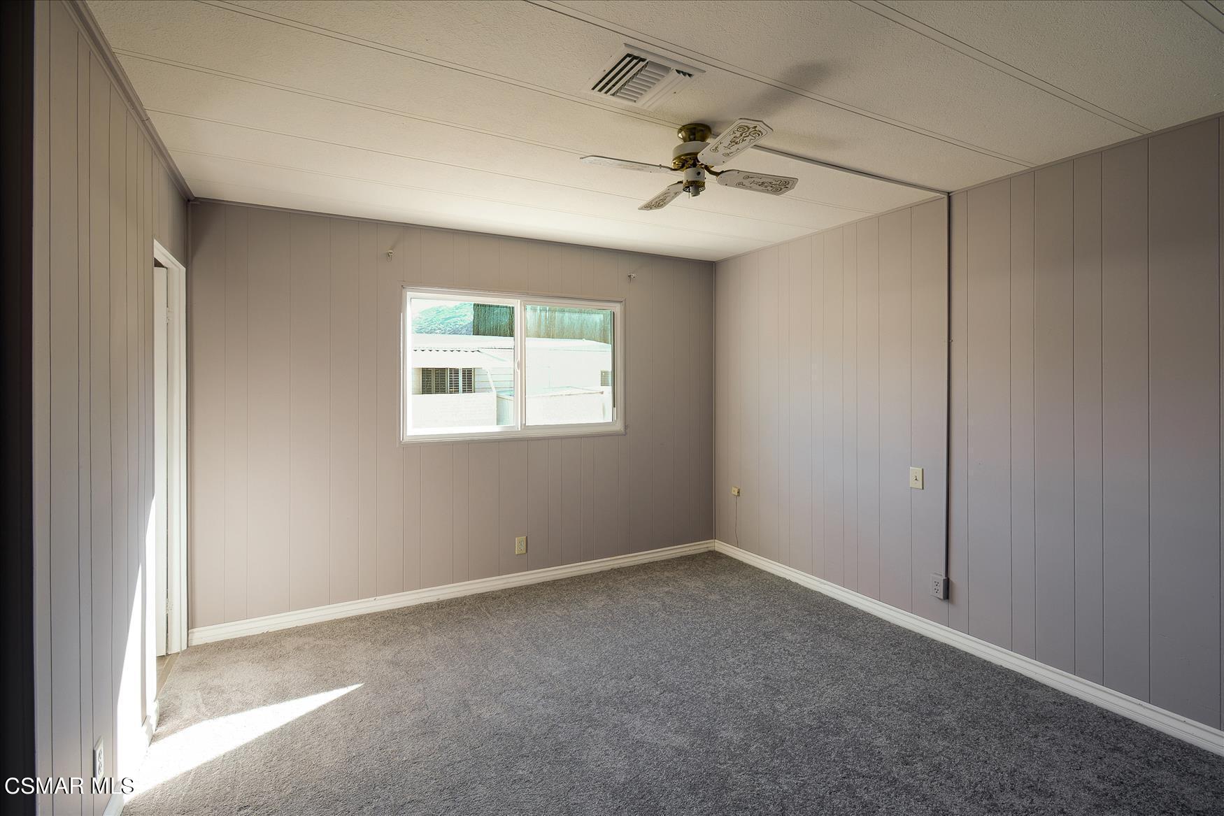 6480 Katherine Road, Unit 21 Simi Valley, CA 93063 - Photo 31 of 42 an empty room with a window and a fan