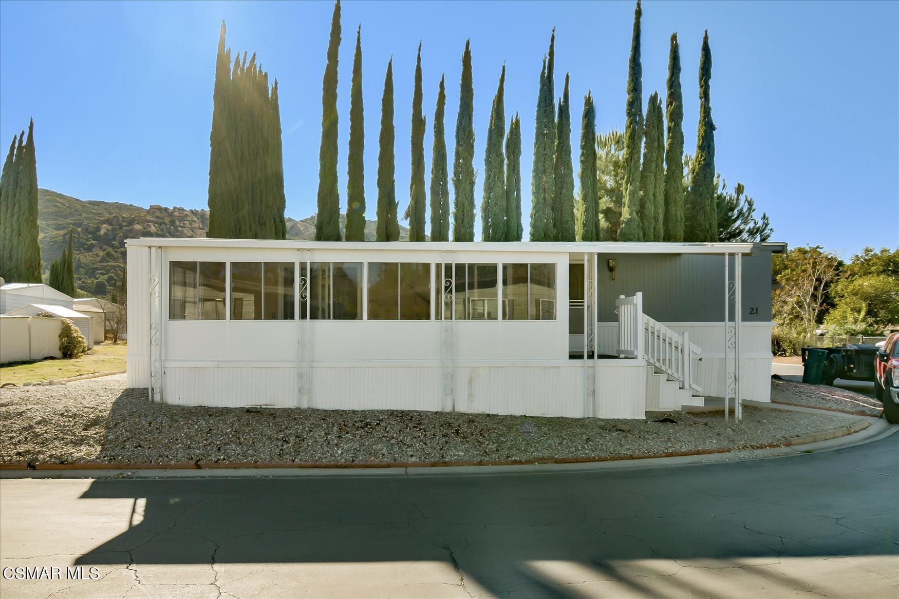 6480 Katherine Road, Unit 21 Simi Valley, CA 93063 - Photo 35 of 42 a view of a house with a yard