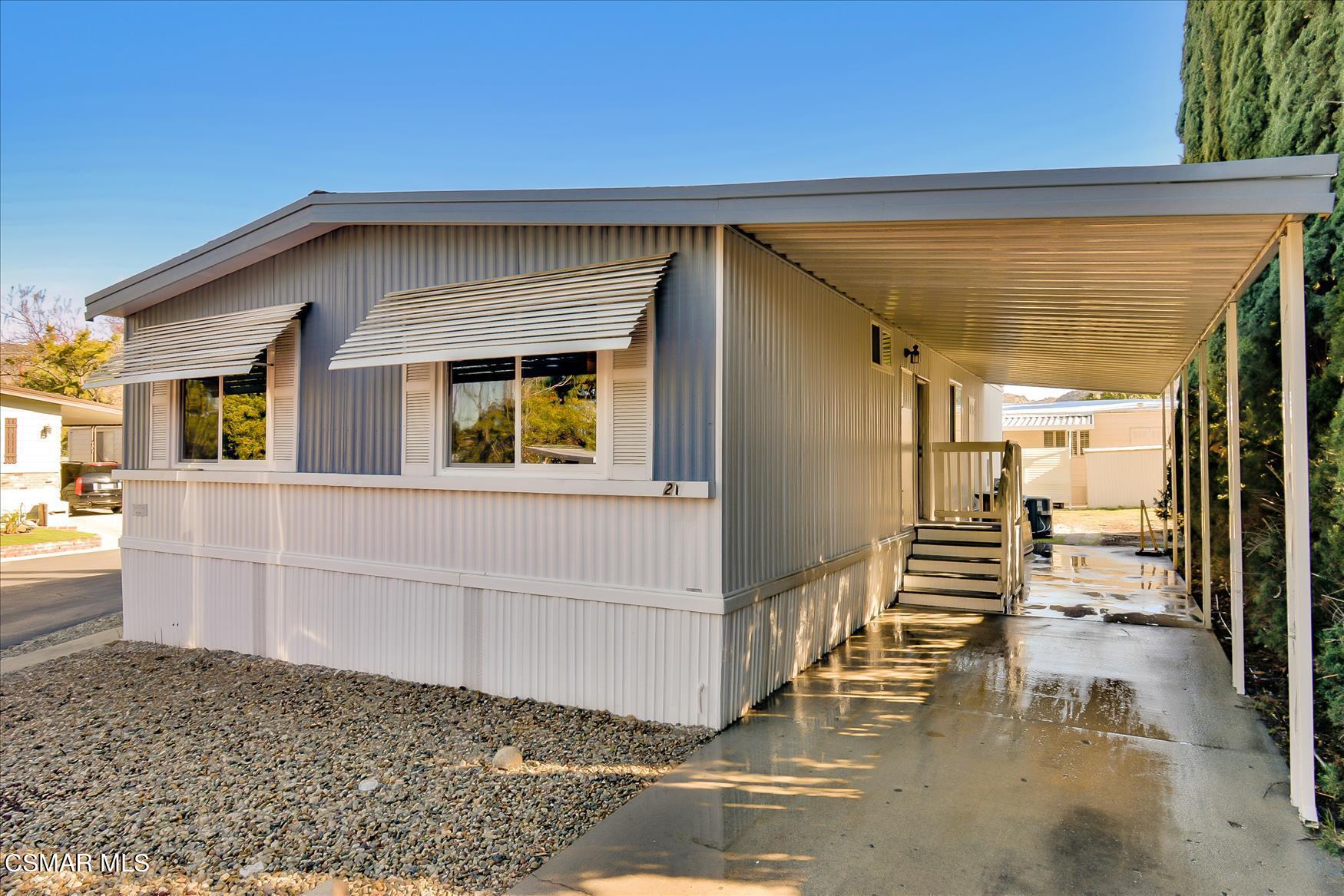 6480 Katherine Road, Unit 21 Simi Valley, CA 93063 - Photo 38 of 42 a view of a house with a wooden deck