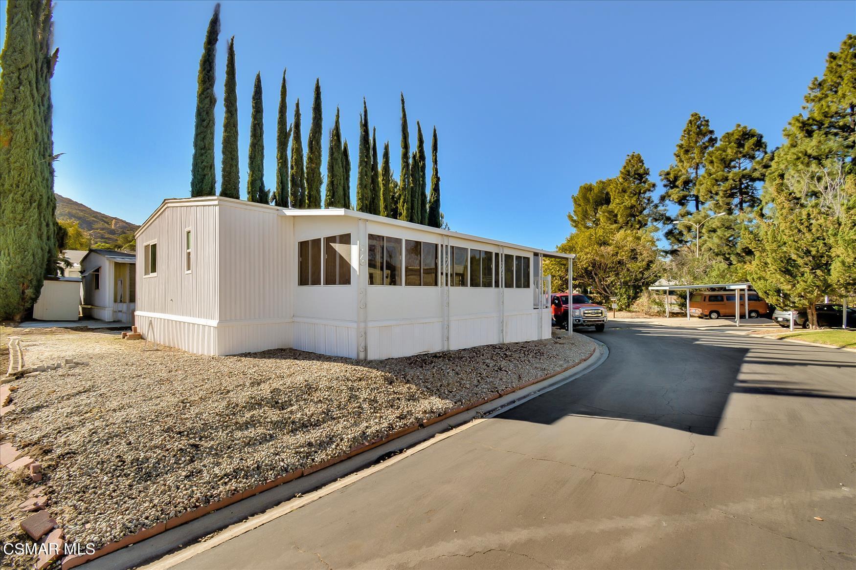 6480 Katherine Road, Unit 21 Simi Valley, CA 93063 - Photo 39 of 42 a view of a house with backyard and sitting area