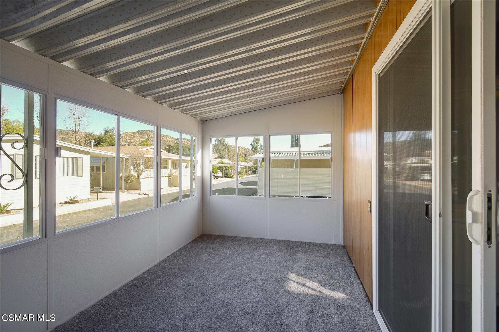 6480 Katherine Road, Unit 21 Simi Valley, CA 93063 - Photo 8 of 42 a view of an empty room with a window