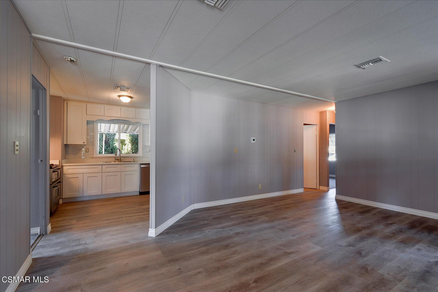 6480 Katherine Road, Unit 21 Simi Valley, CA 93063 - Photo 10 of 42 a view of a kitchen cabinets and wooden floor
