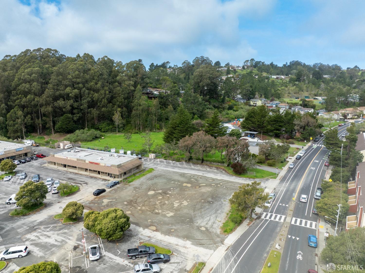 1055 Terra Nova Boulevard Pacifica, CA 94044 - Photo 4 of 13 a view of a street with a yard