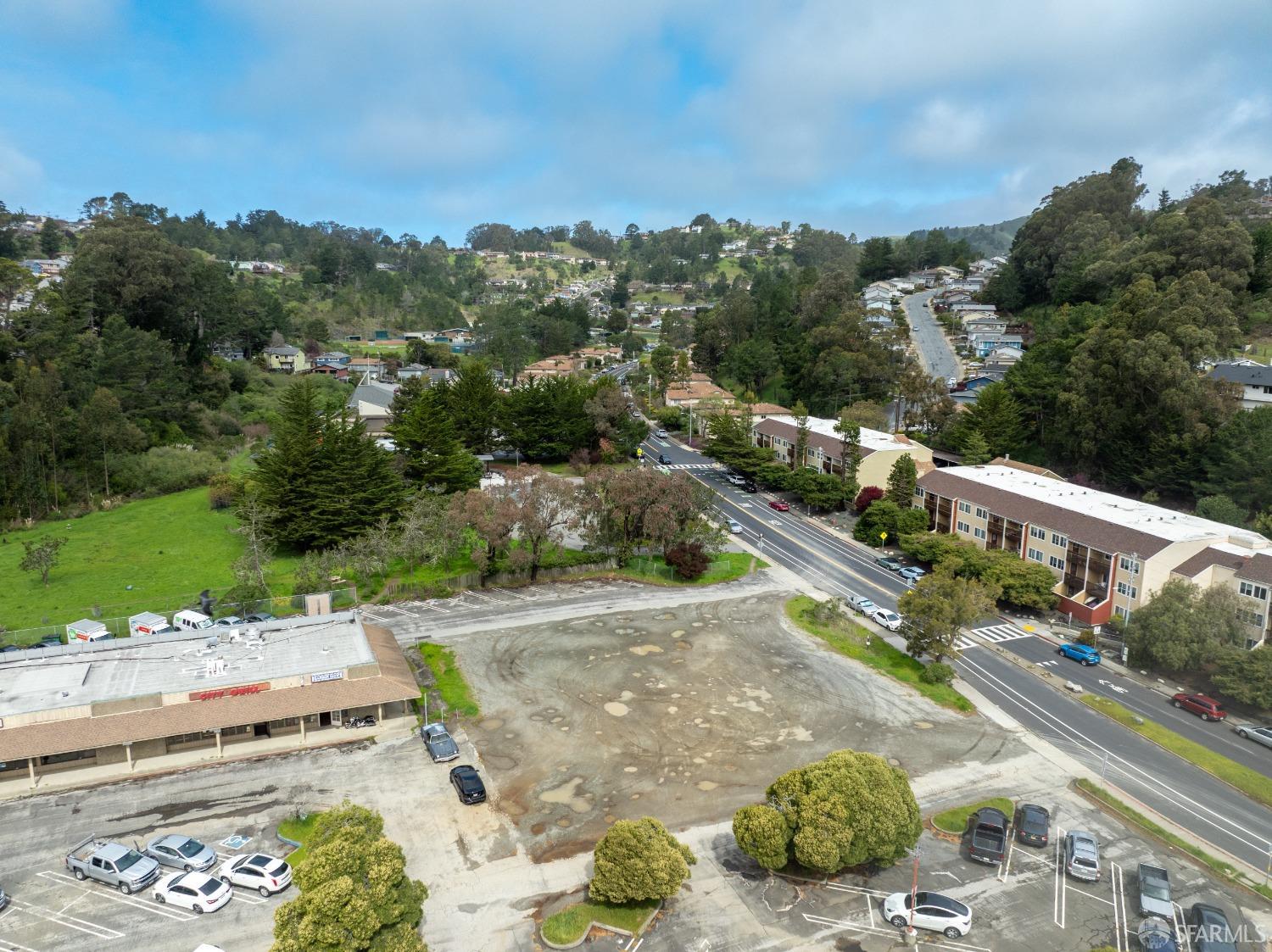 1055 Terra Nova Boulevard Pacifica, CA 94044 - Photo 6 of 13 a view of a street with a houses