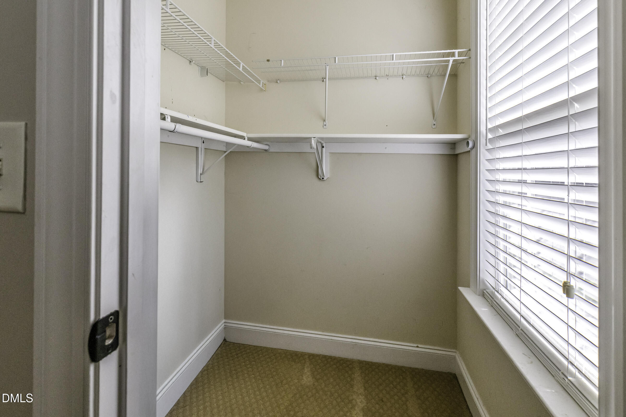 201 Quarryrock Road Holly Springs, NC 27540 - Photo 21 of 34 a view of a room with racks on the wall
