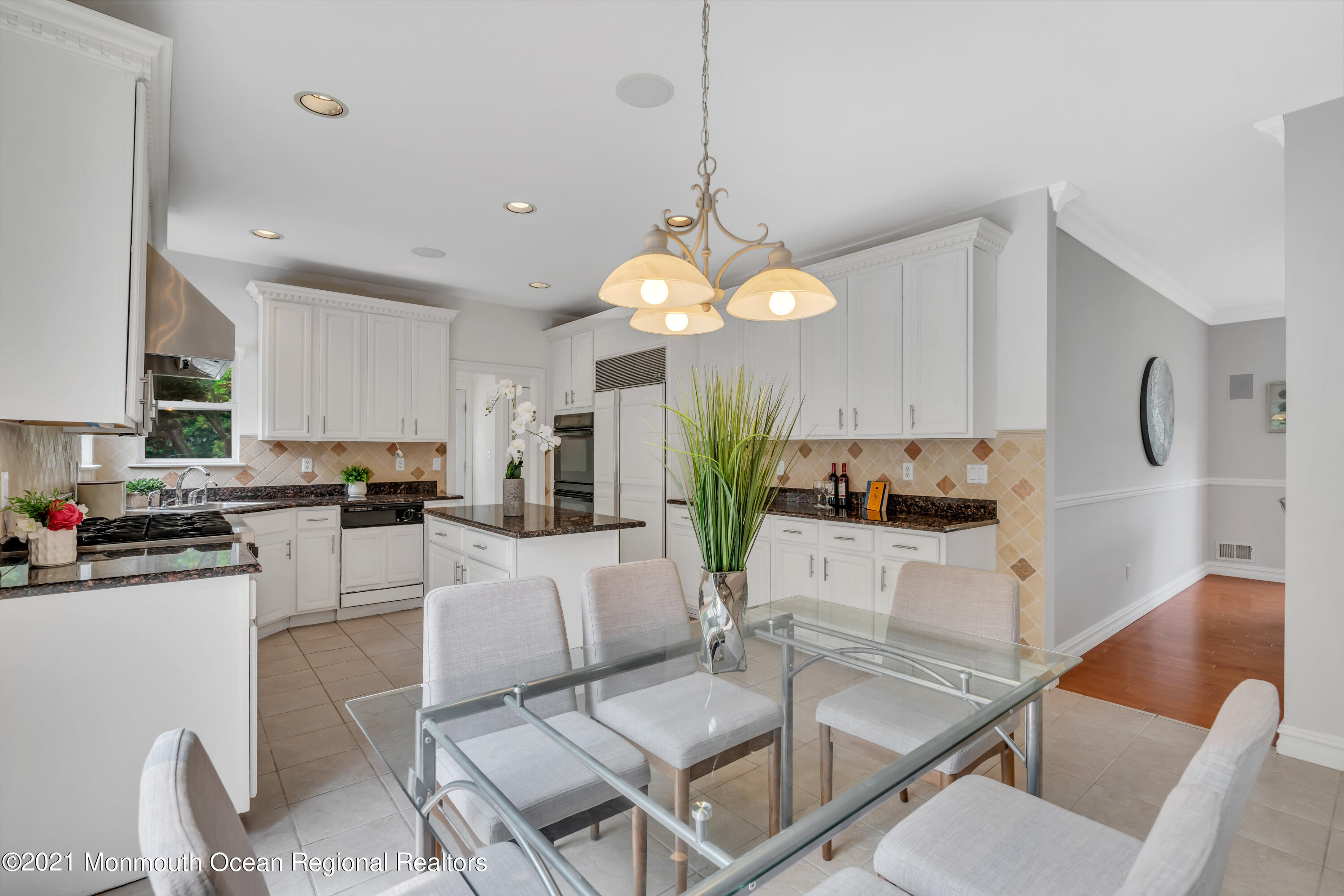20 Highland Drive Jackson, NJ 08527 - Photo 17 of 62 a living room with kitchen island furniture and a chandelier