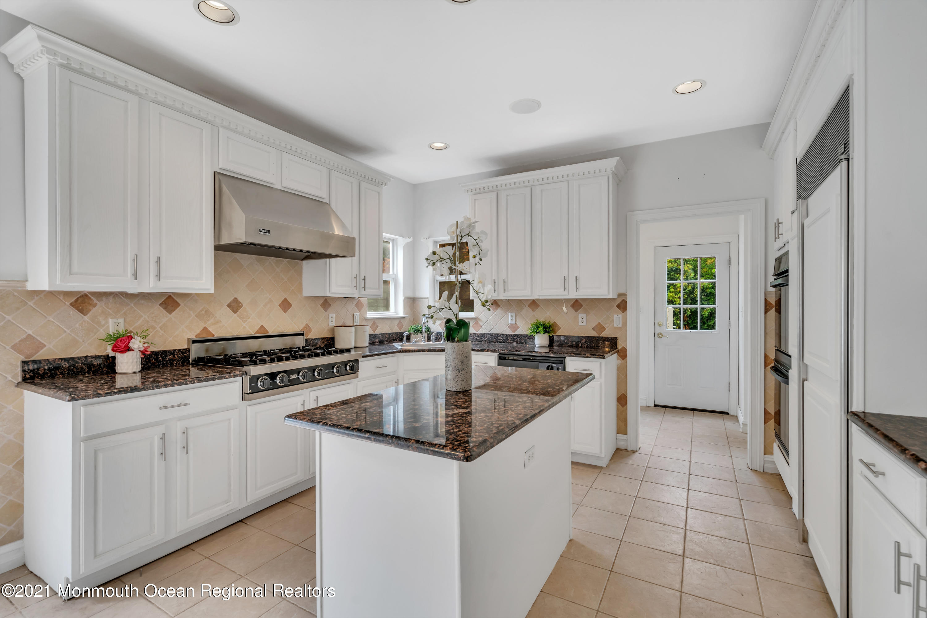 20 Highland Drive Jackson, NJ 08527 - Photo 21 of 62 a kitchen with stainless steel appliances granite countertop a sink stove and refrigerator